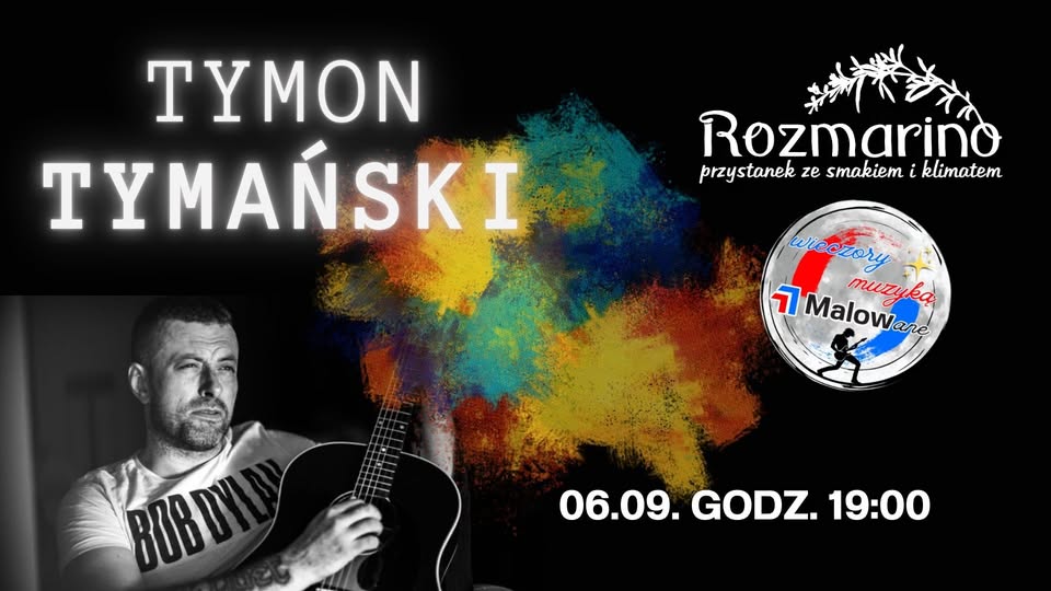 Tymon Tymański podczas koncertu z gitarą
